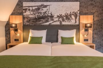 Foto van ruim tweepersoons bed hotelkamer Suite 48m2